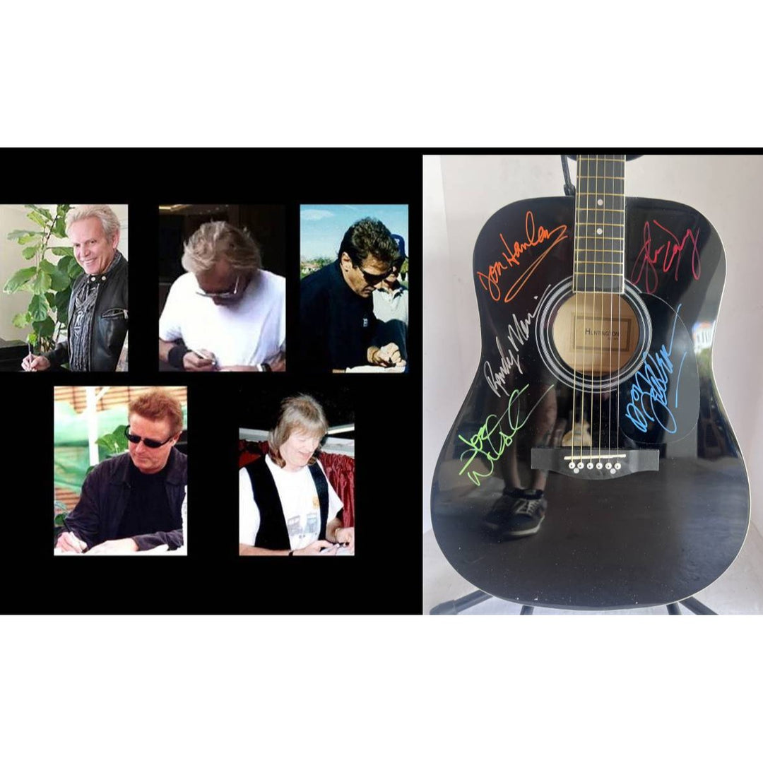 The Eagles Bernie Laden Joe Walsh Don Henley Glenn Frey Randy Meisner signed and inscribed full size acoustic guitar with proof