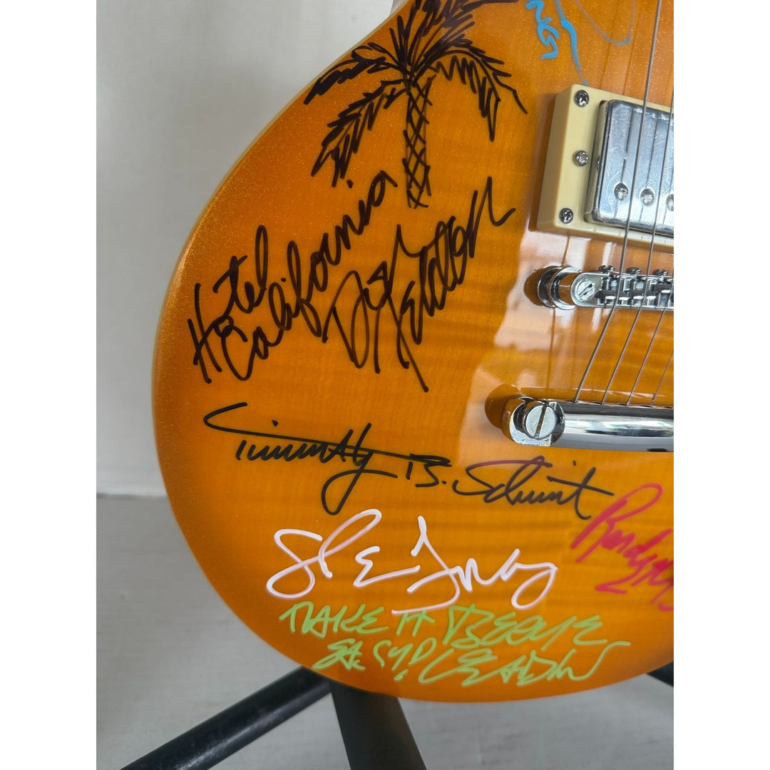 The Eagles Don Henley Glenn Frey Bernie Leadon Timothy B Schmit Joe Walsh Don Felder Randy Meisner Gold Les Paul Guitar signed with proof.