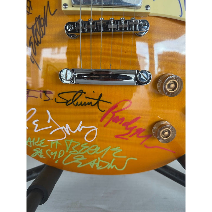 The Eagles Don Henley Glenn Frey Bernie Leadon Timothy B Schmit Joe Walsh Don Felder Randy Meisner Gold Les Paul Guitar signed with proof.