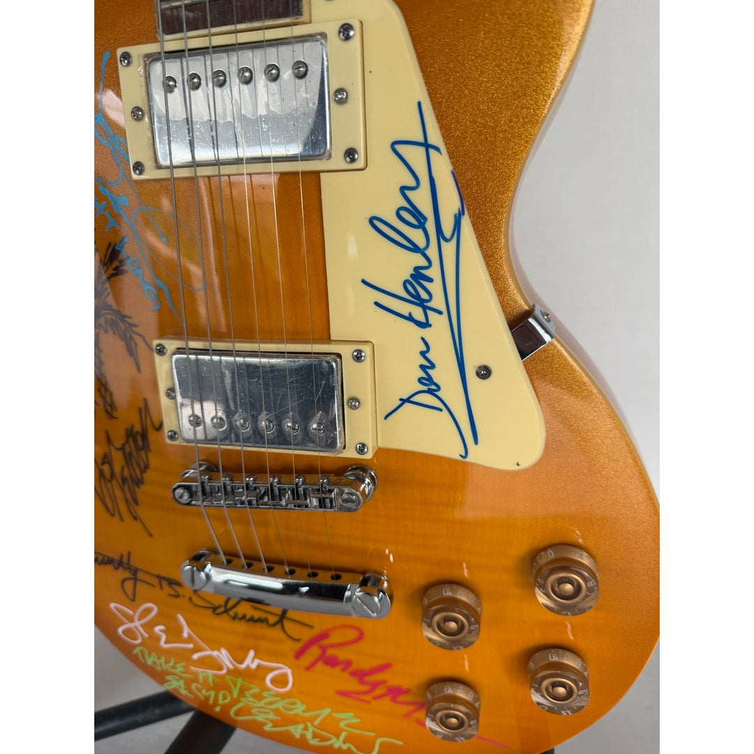 The Eagles Don Henley Glenn Frey Bernie Leadon Timothy B Schmit Joe Walsh Don Felder Randy Meisner Gold Les Paul Guitar signed with proof.