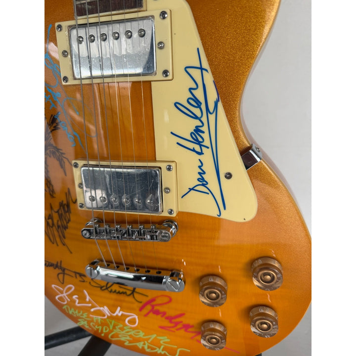 The Eagles Don Henley Glenn Frey Bernie Leadon Timothy B Schmit Joe Walsh Don Felder Randy Meisner Gold Les Paul Guitar signed with proof.