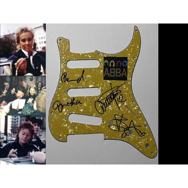 Benny Andersson, Anni-Frid Lyngstad, ABBA  Stratocaster electric pickguard signed with proof