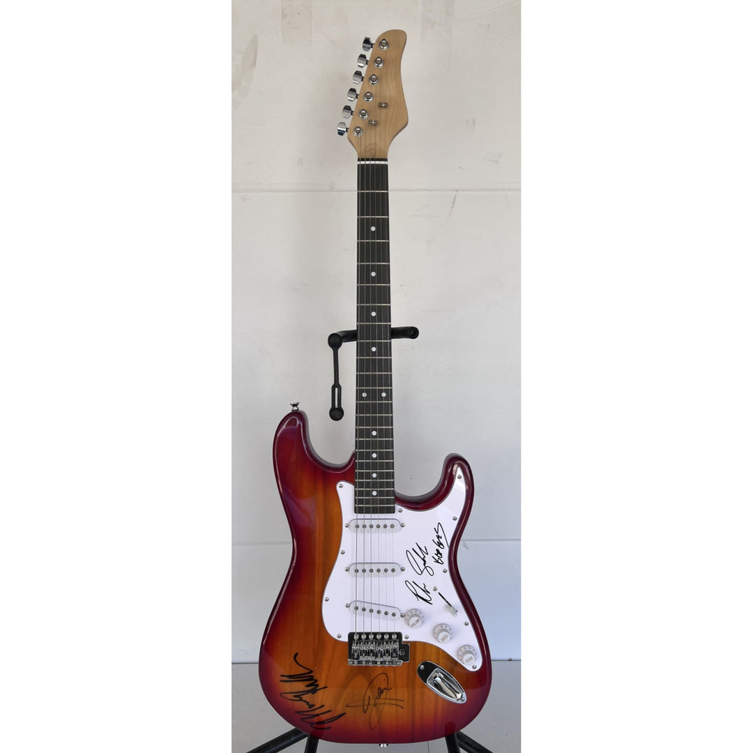 Barry, Robin and Maurice Gibb the Bee Gees electric guitar signed with proof.