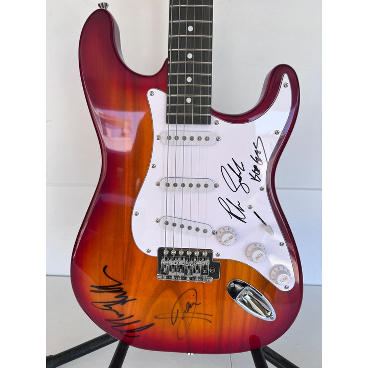 Barry, Robin and Maurice Gibb the Bee Gees electric guitar signed with proof.