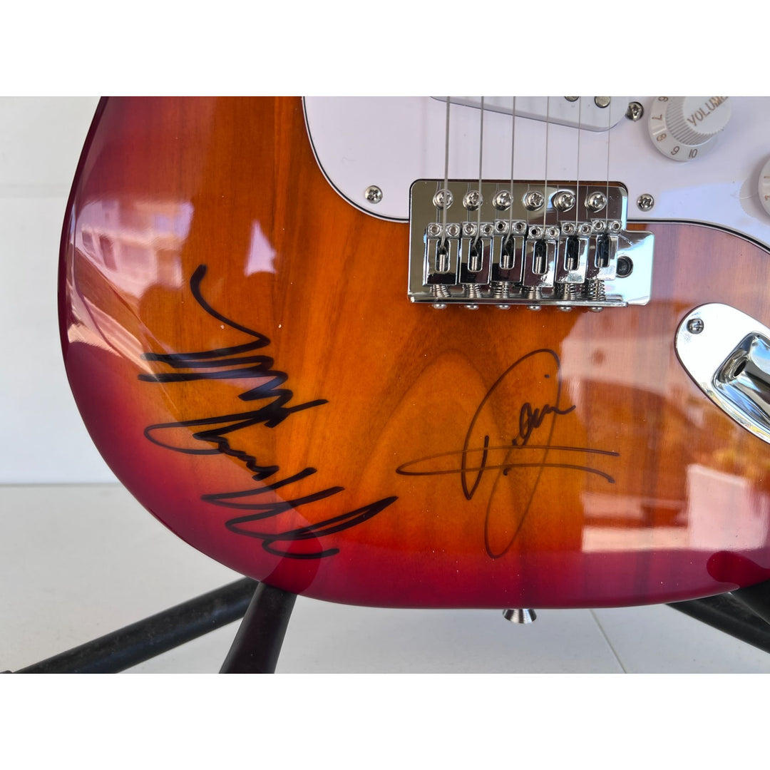 Barry, Robin and Maurice Gibb the Bee Gees electric guitar signed with proof.