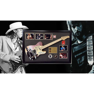 Eric Clapton and Stevie Ray Vaughan with hand made sketch and inscription from (Stevie) full size electric guitar signed and framed