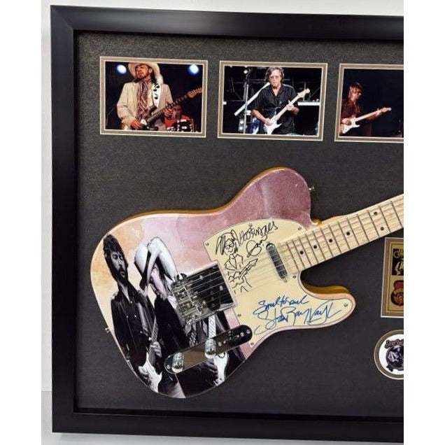 Eric Clapton and Stevie Ray Vaughan with hand made sketch and inscription from (Stevie) full size electric guitar signed and framed.