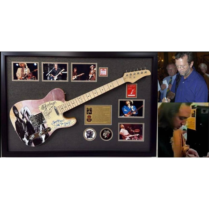 Eric Clapton and Stevie Ray Vaughan with hand made sketch and inscription from (Stevie) full size electric guitar signed and framed.