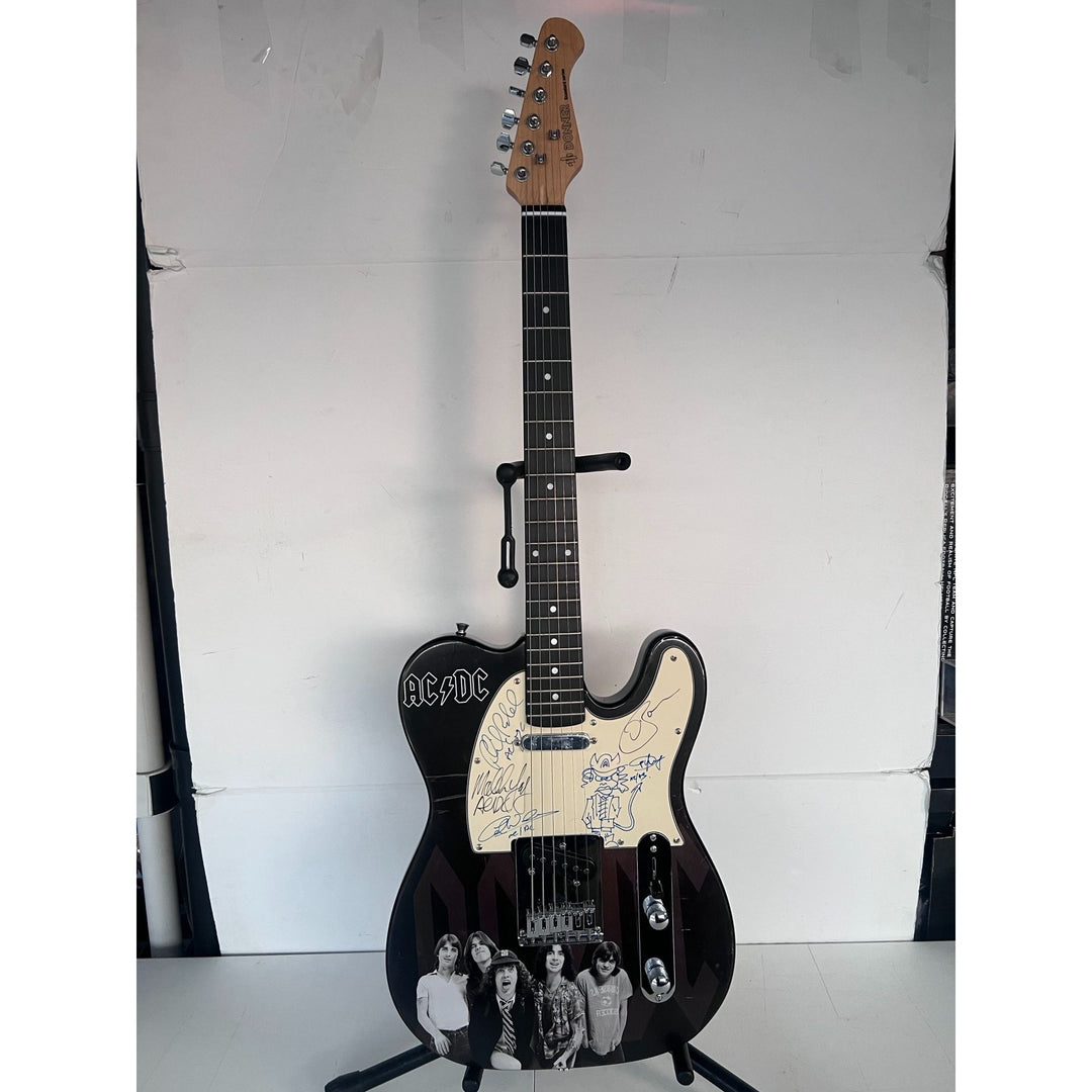 AC/DC Bon Scott, Cliff Williams, Angus Young, Malcolm Young, Phil Rudd one of a kind telecaster full size electric guitar signed with proof.