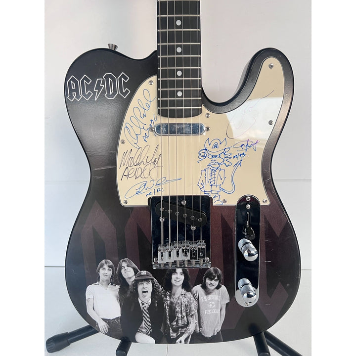 AC/DC Bon Scott, Cliff Williams, Angus Young, Malcolm Young, Phil Rudd one of a kind telecaster full size electric guitar signed with proof.
