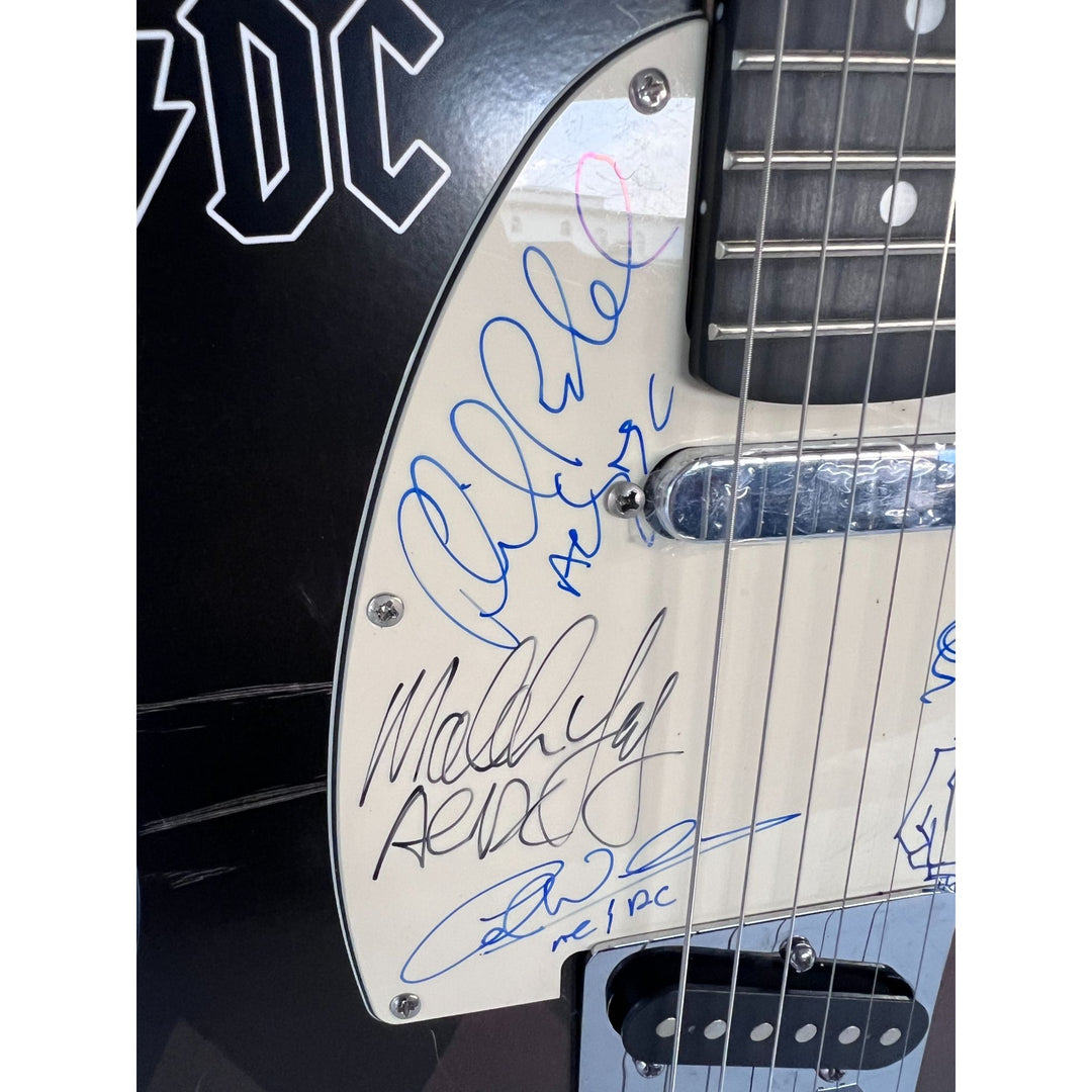 AC/DC Bon Scott, Cliff Williams, Angus Young, Malcolm Young, Phil Rudd one of a kind telecaster full size electric guitar signed with proof.