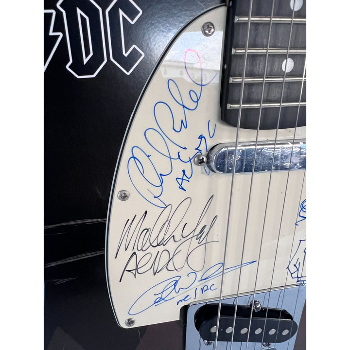 AC/DC Bon Scott, Cliff Williams, Angus Young, Malcolm Young, Phil Rudd one of a kind telecaster full size electric guitar signed with proof.