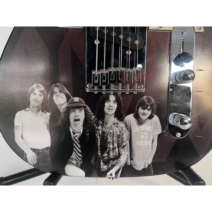 AC/DC Bon Scott, Cliff Williams, Angus Young, Malcolm Young, Phil Rudd one of a kind telecaster full size electric guitar signed with proof.