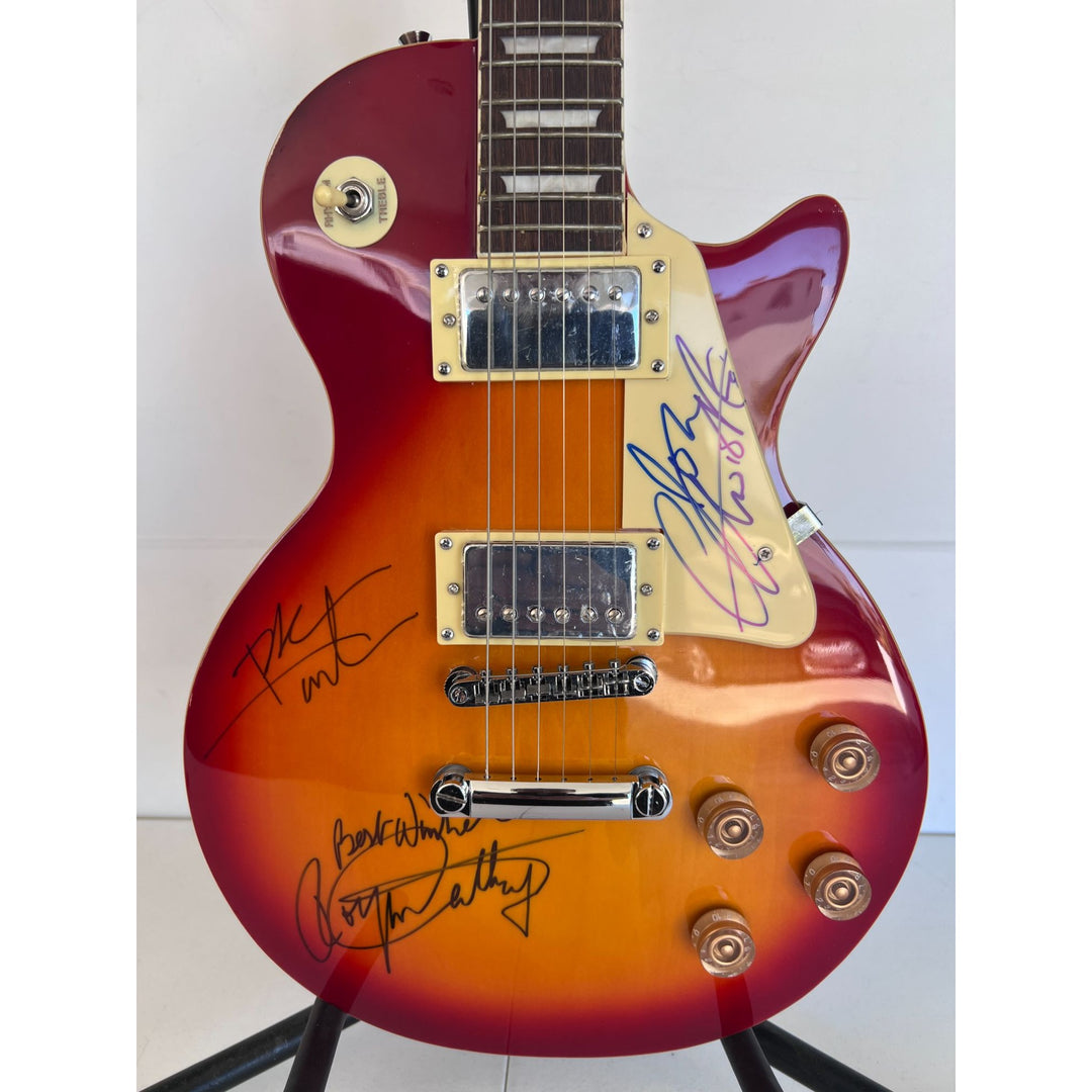 The Who Roger Daltry, Pete Townshend, John Entwhistle full size vintage cherry les paul guitar signed with proof.