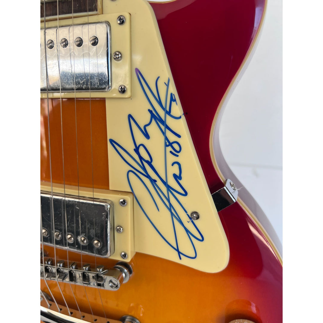 The Who Roger Daltry, Pete Townshend, John Entwhistle full size vintage cherry les paul guitar signed with proof.