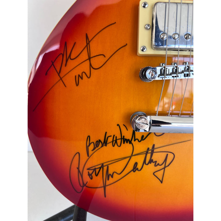 The Who Roger Daltry, Pete Townshend, John Entwhistle full size vintage cherry les paul guitar signed with proof.