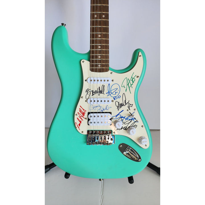 REO Speedwagon Bruce Hall, Dave Matto, Gary Richrath, Kevin Cronin, Neal Dought Fender Stratocaster Squier electric guitar signed with proof