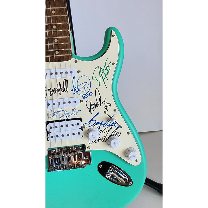 REO Speedwagon Bruce Hall, Dave Matto, Gary Richrath, Kevin Cronin, Neal Dought Fender Stratocaster Squier electric guitar signed with proof
