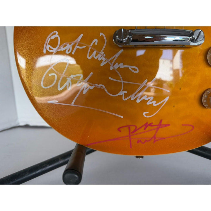 The Who Pete Townshend, Roger Daltrey, John Entwistle, Keith Moon gold les paul electric guitar signed with proof.
