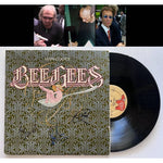 Load image into Gallery viewer, Barry, Robin and Maurice Gibb the Bee Gees Main Course LP signed with proof
