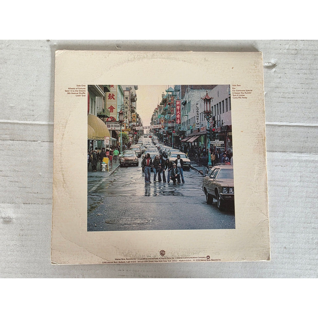 The Doobie Brothers ''Living on the Fault Line'' LP signed with proof.