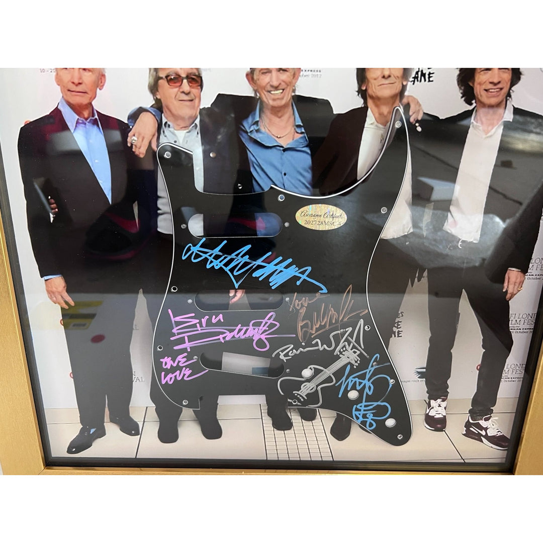 Mick Jagger Keith Richards Bill Wyman Charlie Watts Ronnie Wood Fender Stratocaster electric guitar pickguard signed and framed (17x19)