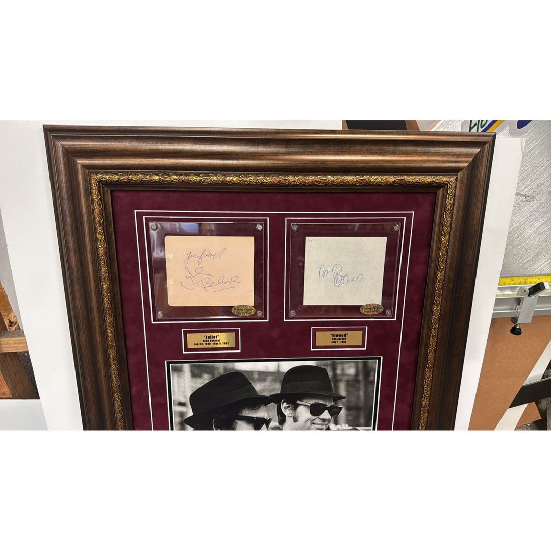 The Blues Brothers John Belushi & Dan Akroyd autograph book page signed with proof & museum quality frame with plexi 25x35.