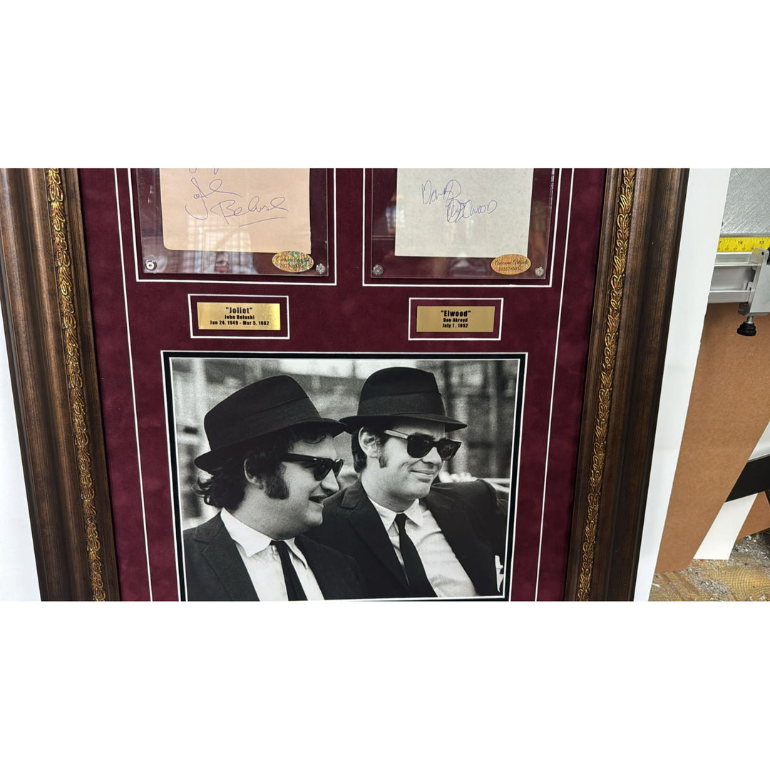 The Blues Brothers John Belushi & Dan Akroyd autograph book page signed with proof & museum quality frame with plexi 25x35.