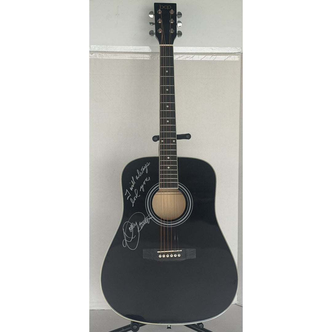 Dolly Parton black acoustic guitar signed with proof.