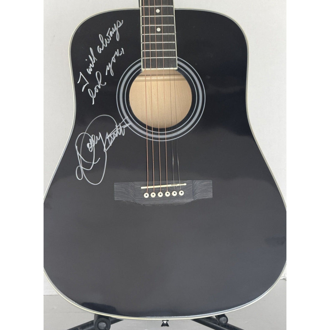 Dolly Parton black acoustic guitar signed with proof.