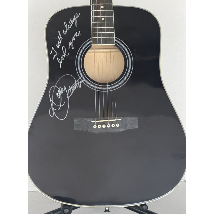 Dolly Parton black acoustic guitar signed with proof.