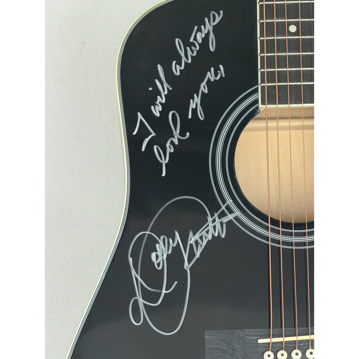Dolly Parton black acoustic guitar signed with proof.