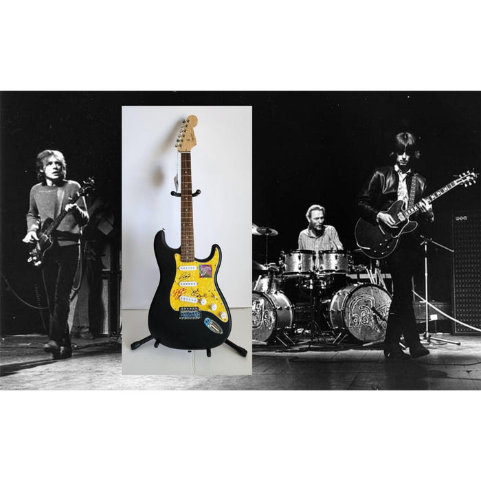 Eric Clapton, Ginger Baker, Jack Bruce, Cream, authentic Fender Stratocaster electric guitar signed with proof
