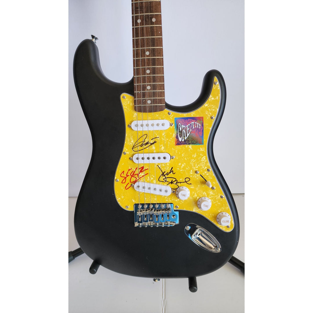 Eric Clapton, Ginger Baker, Jack Bruce, Cream, authentic Fender Stratocaster electric guitar signed with proof