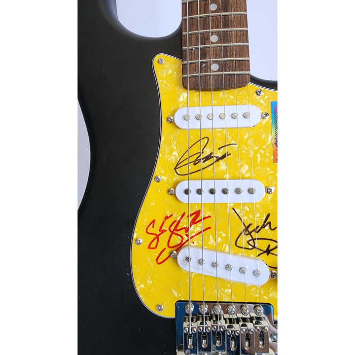 Eric Clapton, Ginger Baker, Jack Bruce, Cream, authentic Fender Stratocaster electric guitar signed with proof