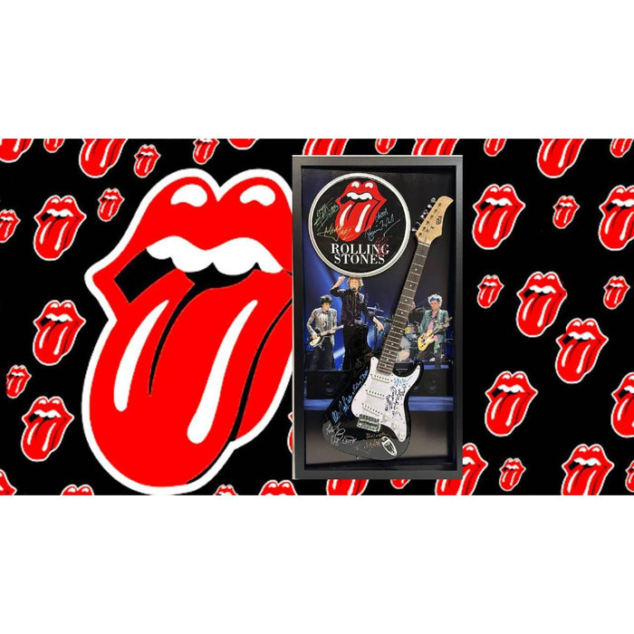 Rolling Stones Stratocaster electric guitar and 14in drum head signed with proof and museum quality frame