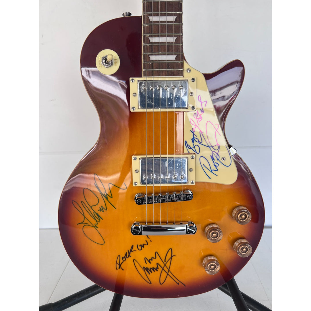 Led Zeppelin Jimmy Page with inscription Rock On! Robert Plant, and John Paul Jones vintage les paul signed with proof.