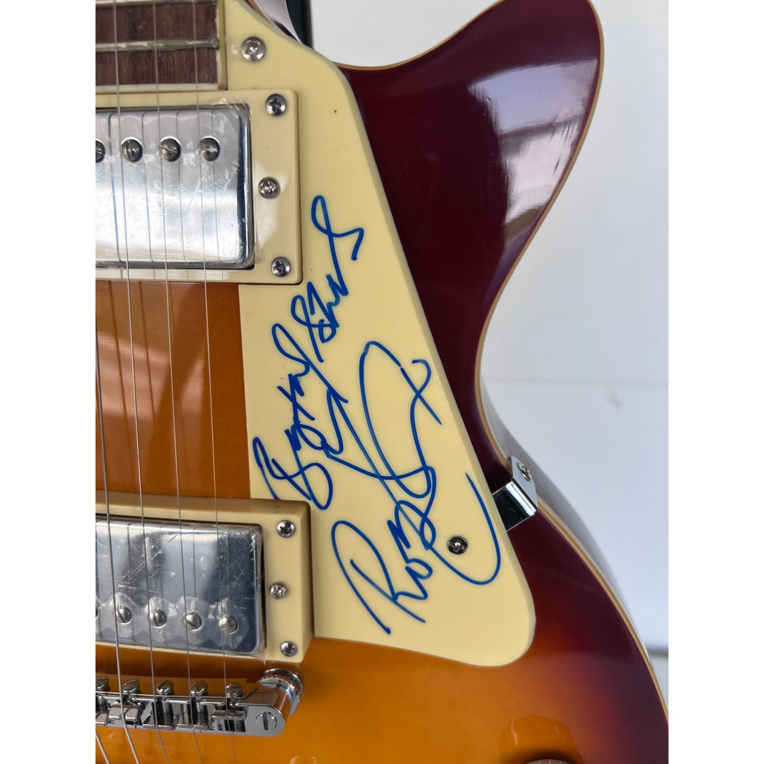 Led Zeppelin Jimmy Page with inscription Rock On! Robert Plant, and John Paul Jones vintage les paul signed with proof.