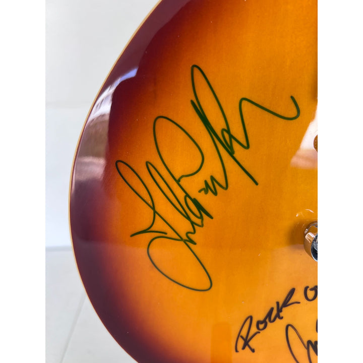 Led Zeppelin Jimmy Page with inscription Rock On! Robert Plant, and John Paul Jones vintage les paul signed with proof.