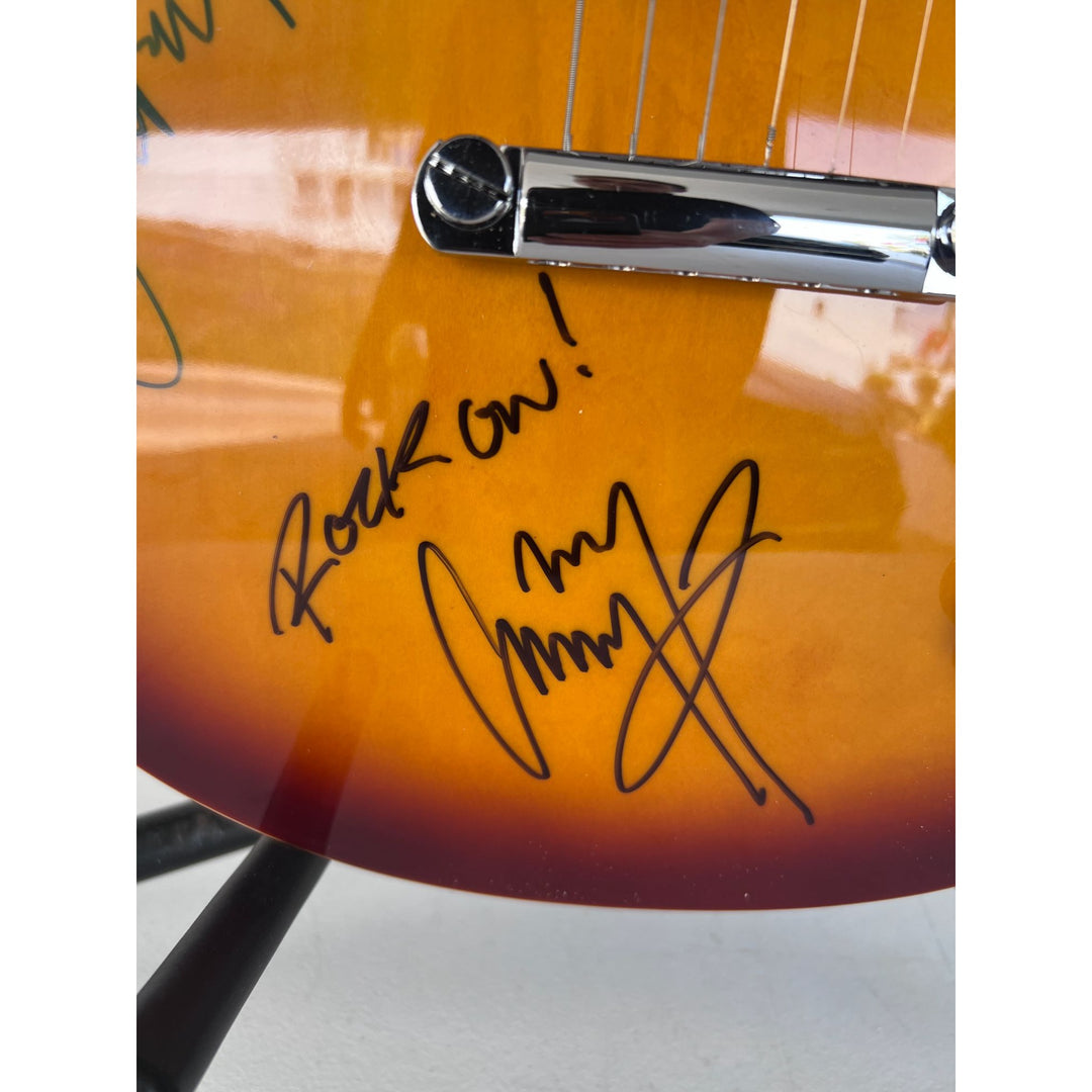 Led Zeppelin Jimmy Page with inscription Rock On! Robert Plant, and John Paul Jones vintage les paul signed with proof.