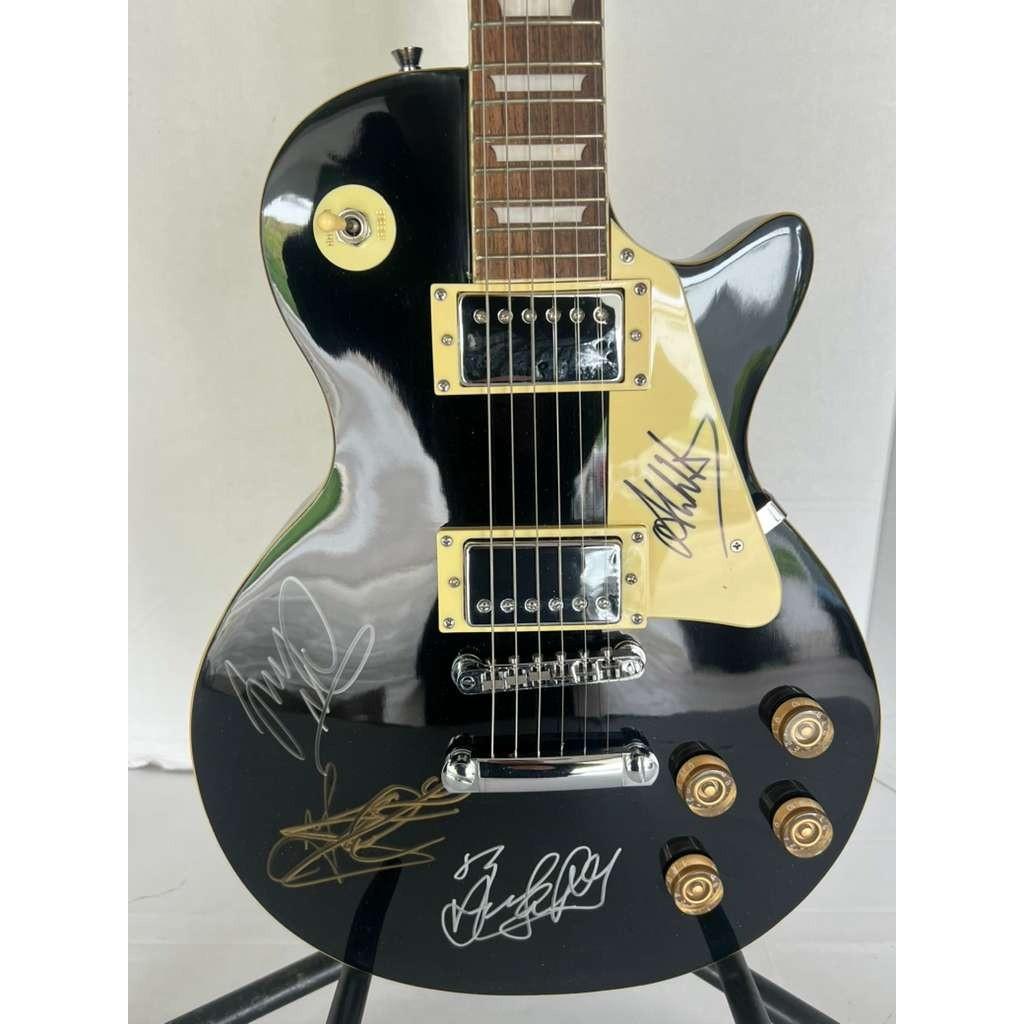 Depeche Mode Alan Wilder, Dave Gahan, Martin Gore, and Andrew Fletcher Black les paul electric guitar signed with proof