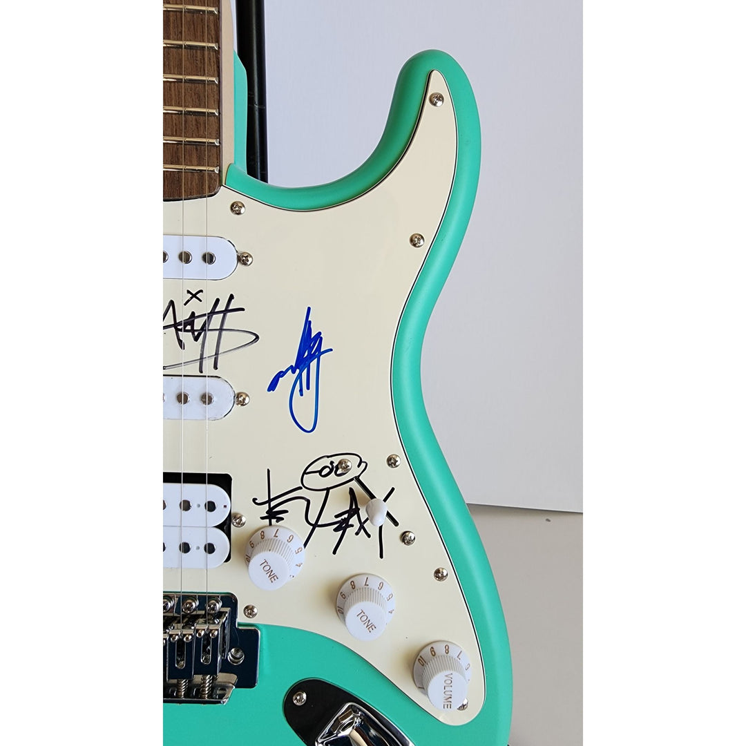 Blink 182 Travis Barker, Mark Hoppus, Tom De Longe authentic Fender Stratocaster electric guitar signed with proof
