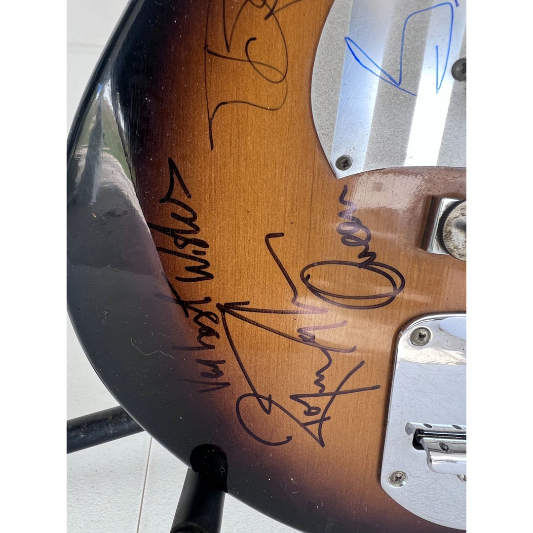 Freddie Mercury Brian May, Roger Taylor, John Deacon Queen vintage guitar signed with proof.