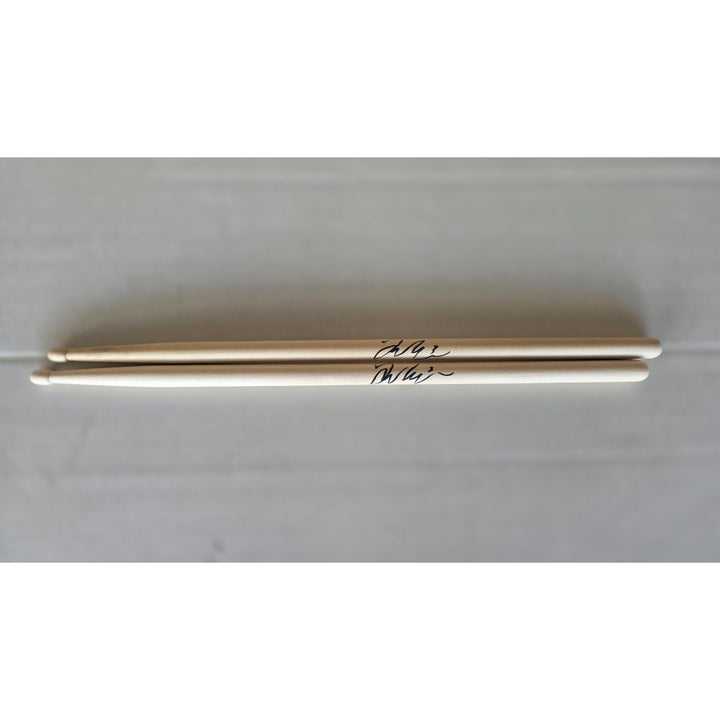 Taylor Hawkins Foo Fighters pair of drumsticks signed with proof.