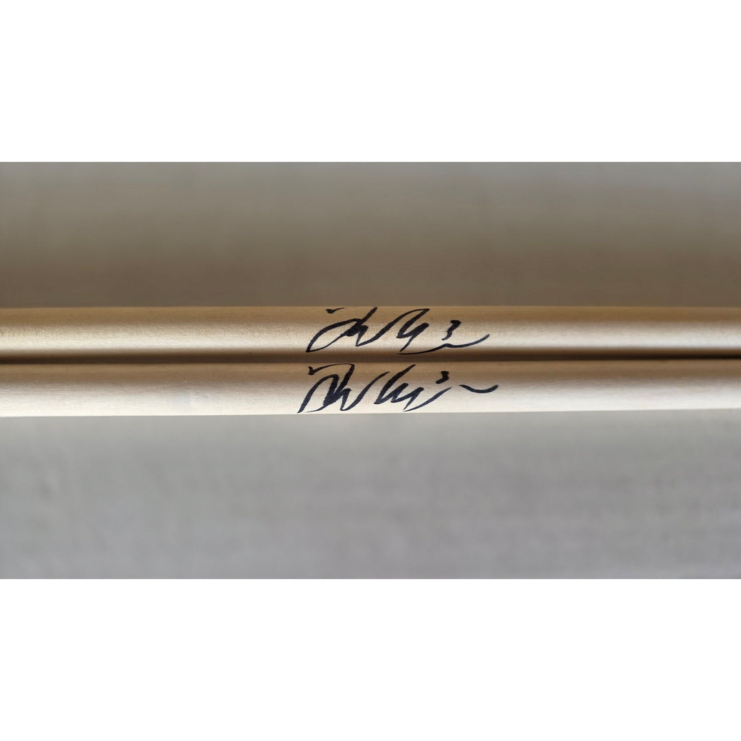 Taylor Hawkins Foo Fighters pair of drumsticks signed with proof.