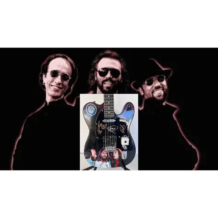 Barry, Robin and Maurice Gibb the Bee Gees  One of a Kind" telecaster full size electric guitar signed with proof.