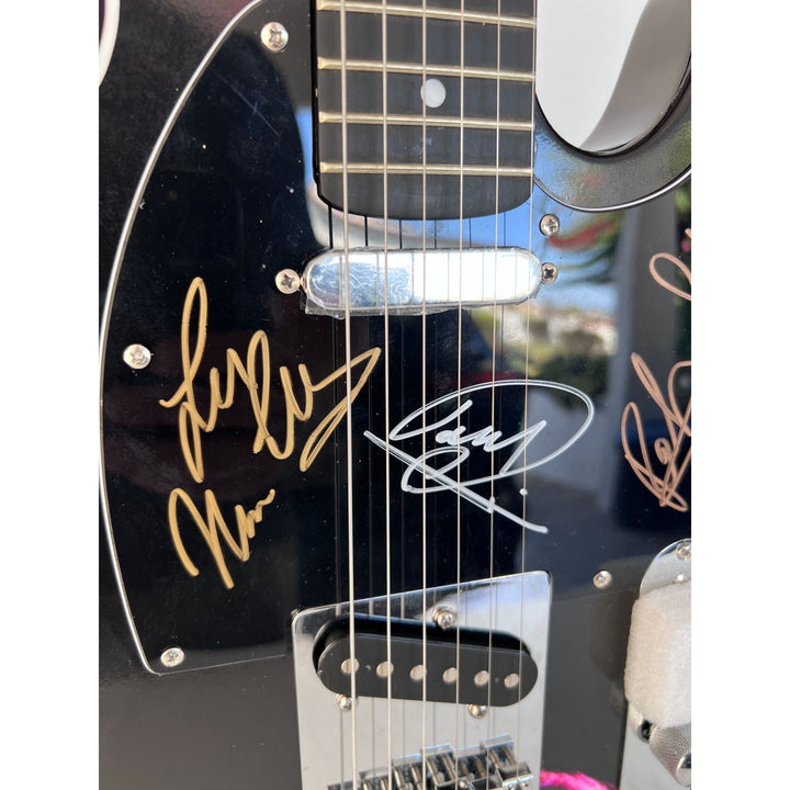 Barry, Robin and Maurice Gibb the Bee Gees  One of a Kind" telecaster full size electric guitar signed with proof.