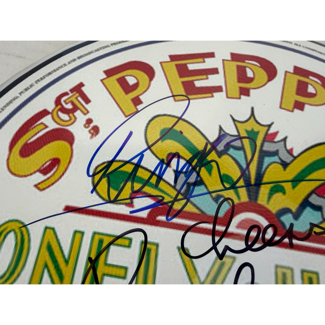 Paul McCartney Ringo Starr and Sir George Martin drumhead signed with proof.