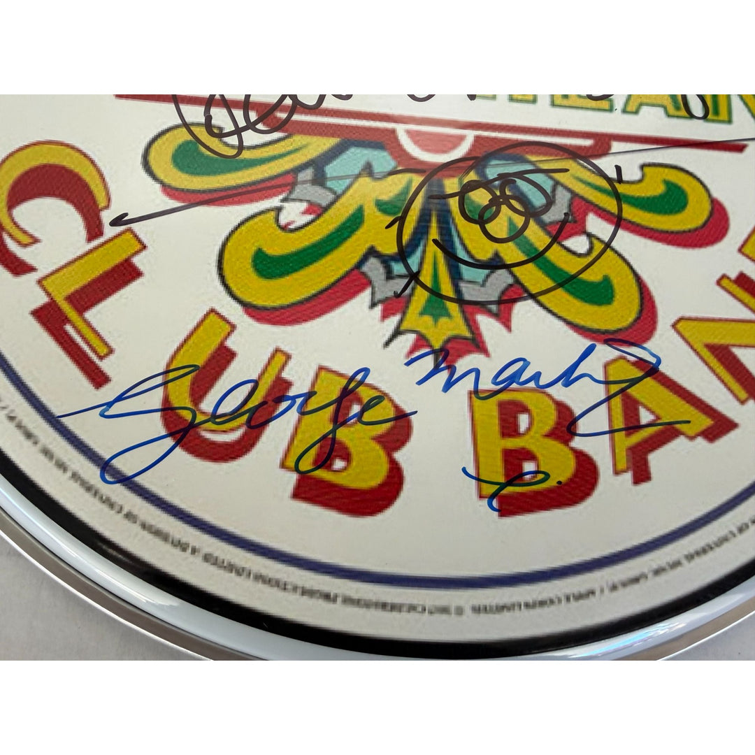 Paul McCartney Ringo Starr and Sir George Martin drumhead signed with proof.