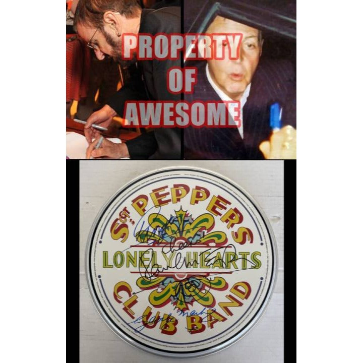 Paul McCartney Ringo Starr and Sir George Martin drumhead signed with proof.